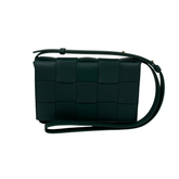 Dark green woven leather crossbody bag with adjustable strap and square quilted panels