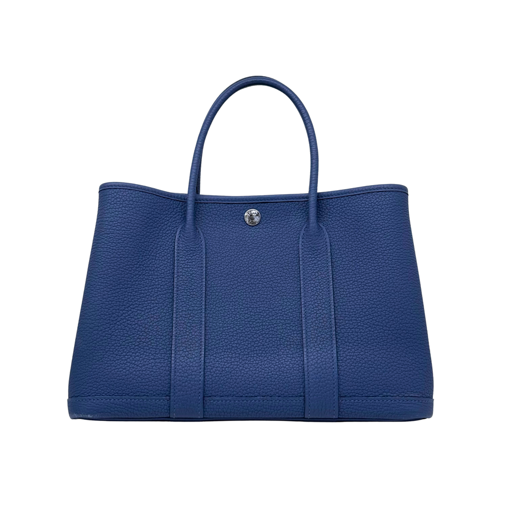 Hermes blue textured leather tote bag with two top handles and front button