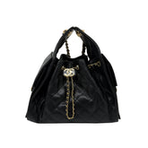 Black quilted Chanel hobo bag with gold chain strap and double top handles