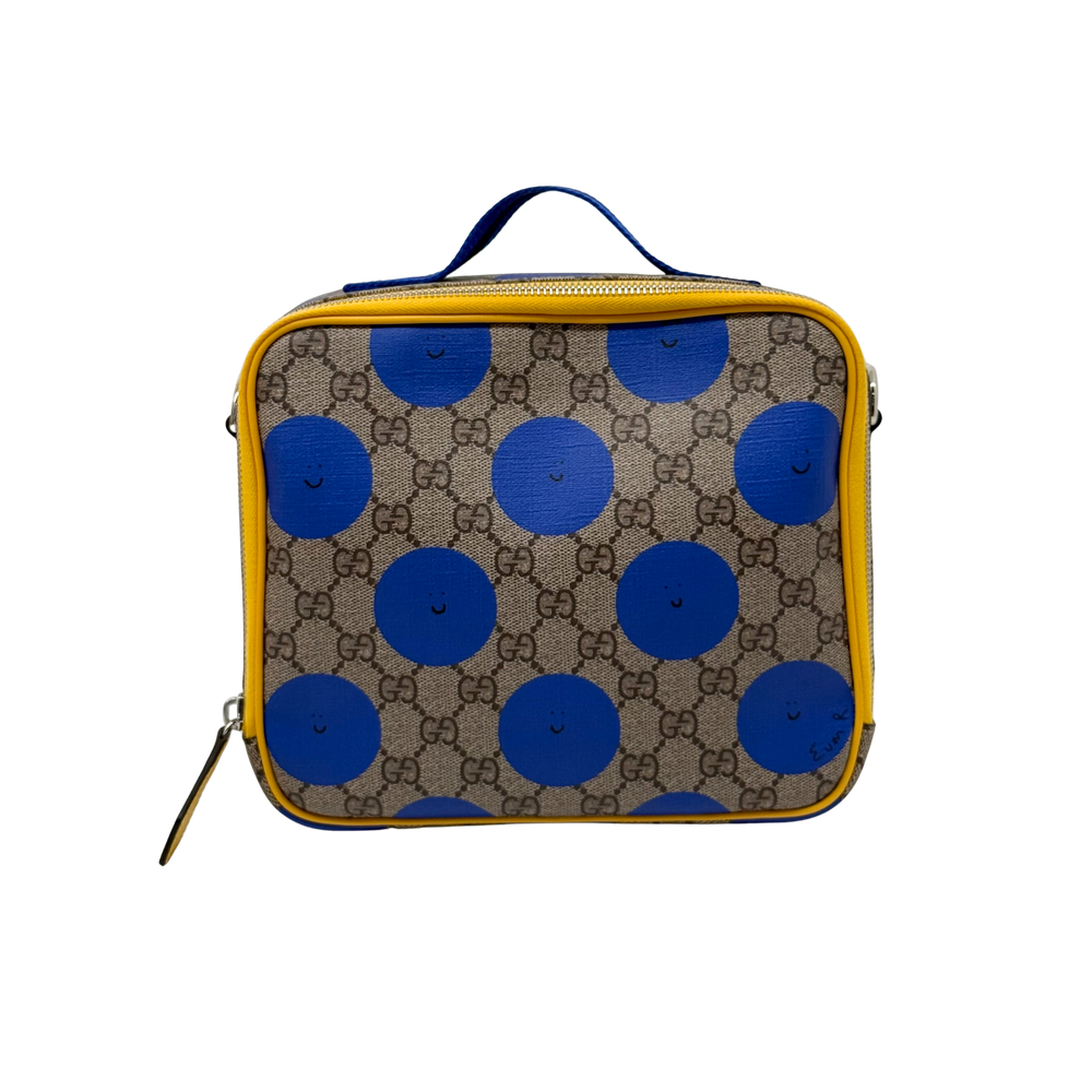 Gucci GG Supreme canvas bag with blue polka-dot smiley faces, blue handle, yellow trim