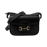 Gucci black leather small crossbody bag with flap closure and adjustable strap