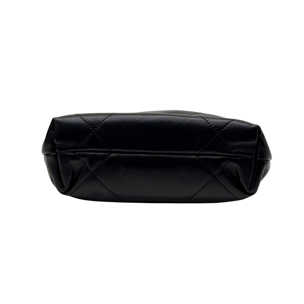 Black quilted mini crossbody bag, back view with smooth top panel and seam details.