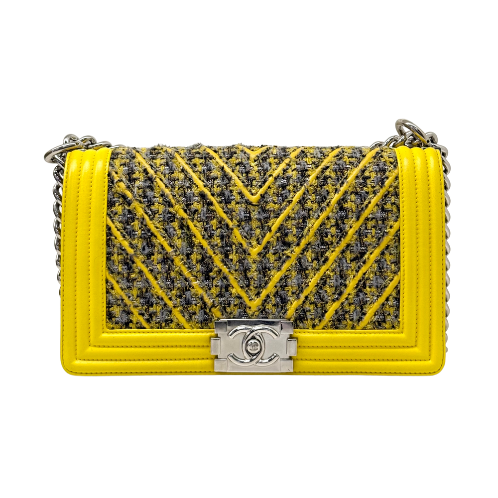 Yellow tweed medium boy bag with chevron quilting, Chanel logo turn-lock, and chain handle.