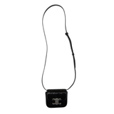Black mini Celine crossbody bag with long strap and silver Triomphe clasp on flap