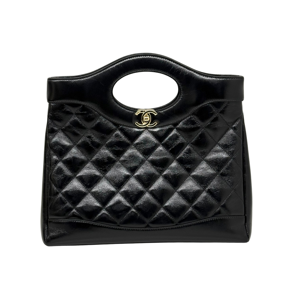 Chanel mini shopping bag front view, black shiny quilted leather with gold logo clasp