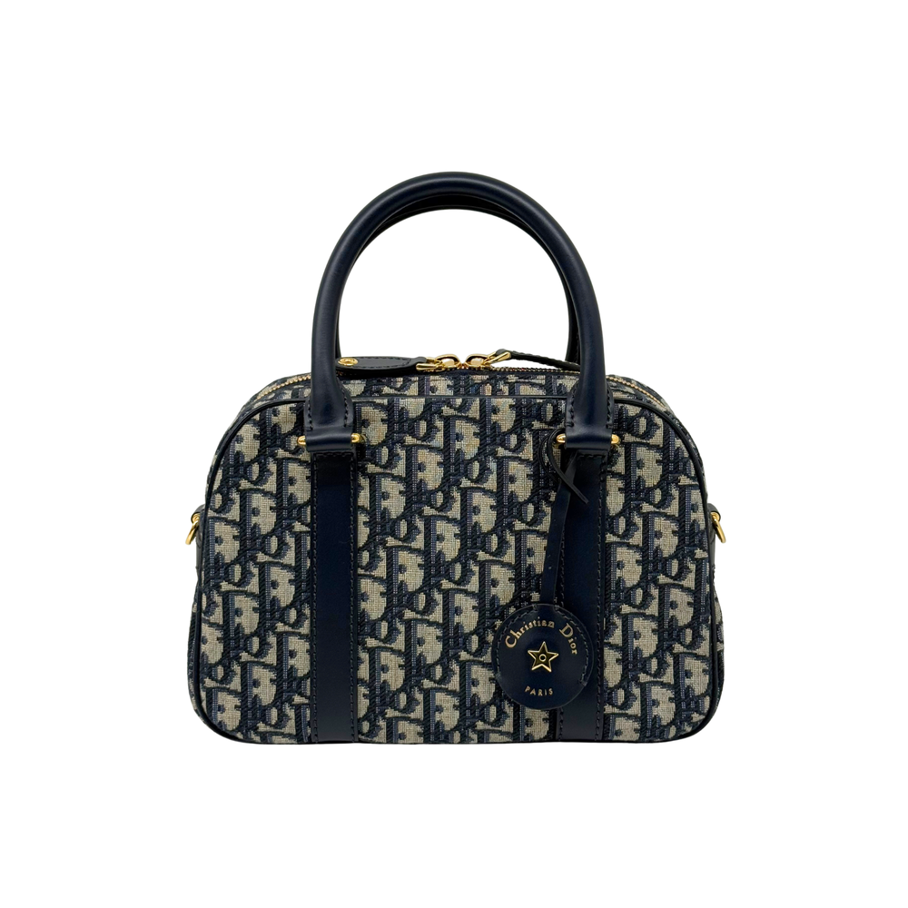 Dior monogram duffel bag with navy handles and side zip detailing, gold hardware