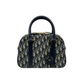 Dior monogram duffel bag with navy handles and side zip detailing, gold hardware