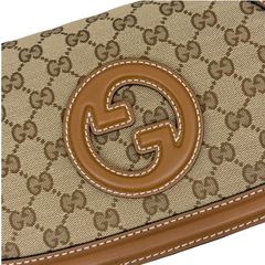 Gucci GG canvas flap with brown leather interlocking G logo patch