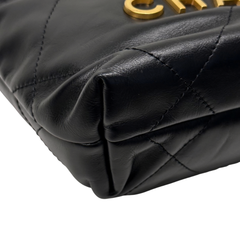 Black quilted calfskin mini crossbody bag with gathered front and stitched seams.
