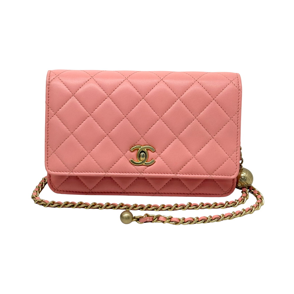 Peach quilted wallet on chain with CC logo on flap and gold-tone chain strap