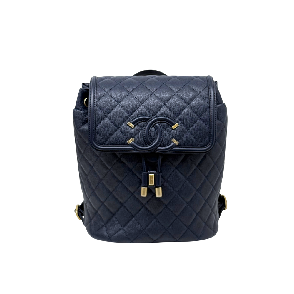 Chanel navy quilted backpack with front flap and gold-tone turn-lock clasp