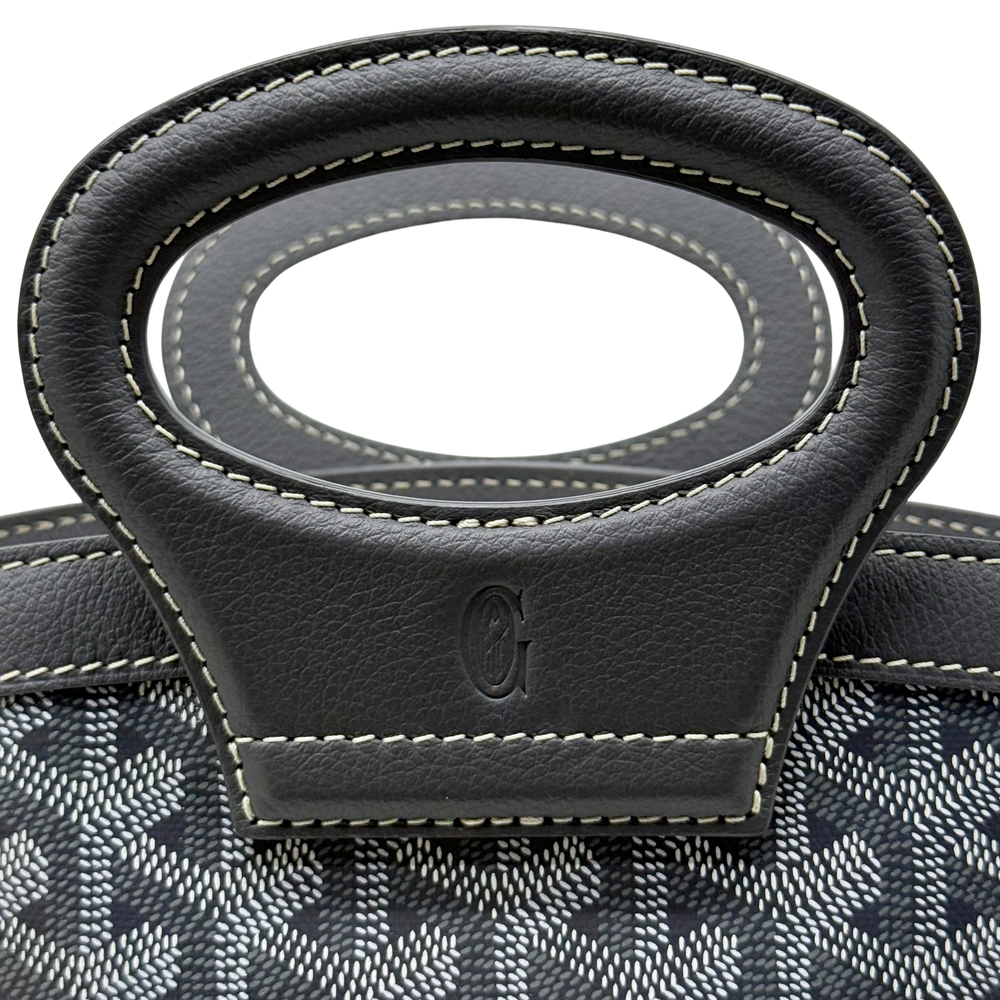 Pre-owned Goyard bag front handle mount with stitched black leather tab and emblem