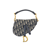 Pre-owned Dior saddle bag front view with monogram canvas, black strap, gold D charm