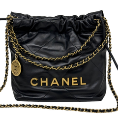 Black quilted mini hobo crossbody bag with gold chain strap and CHANEL logo charm