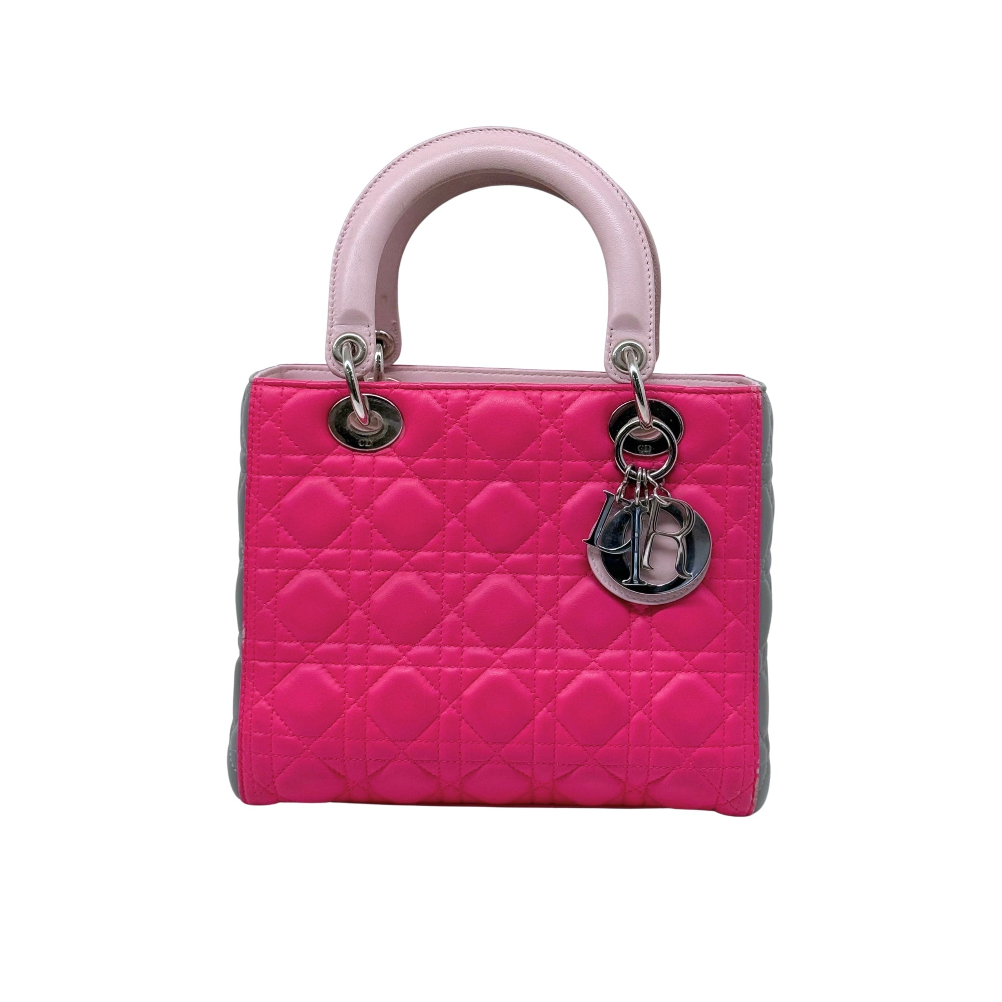 Fuchsia quilted handbag with pink handles, gray sides, and silver hardware rings