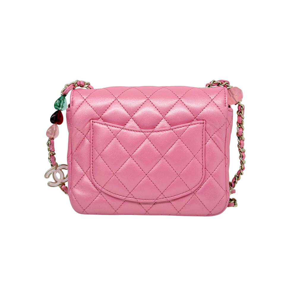 Chanel pink quilted crossbody bag with front flap, gold CC logo, chain straps