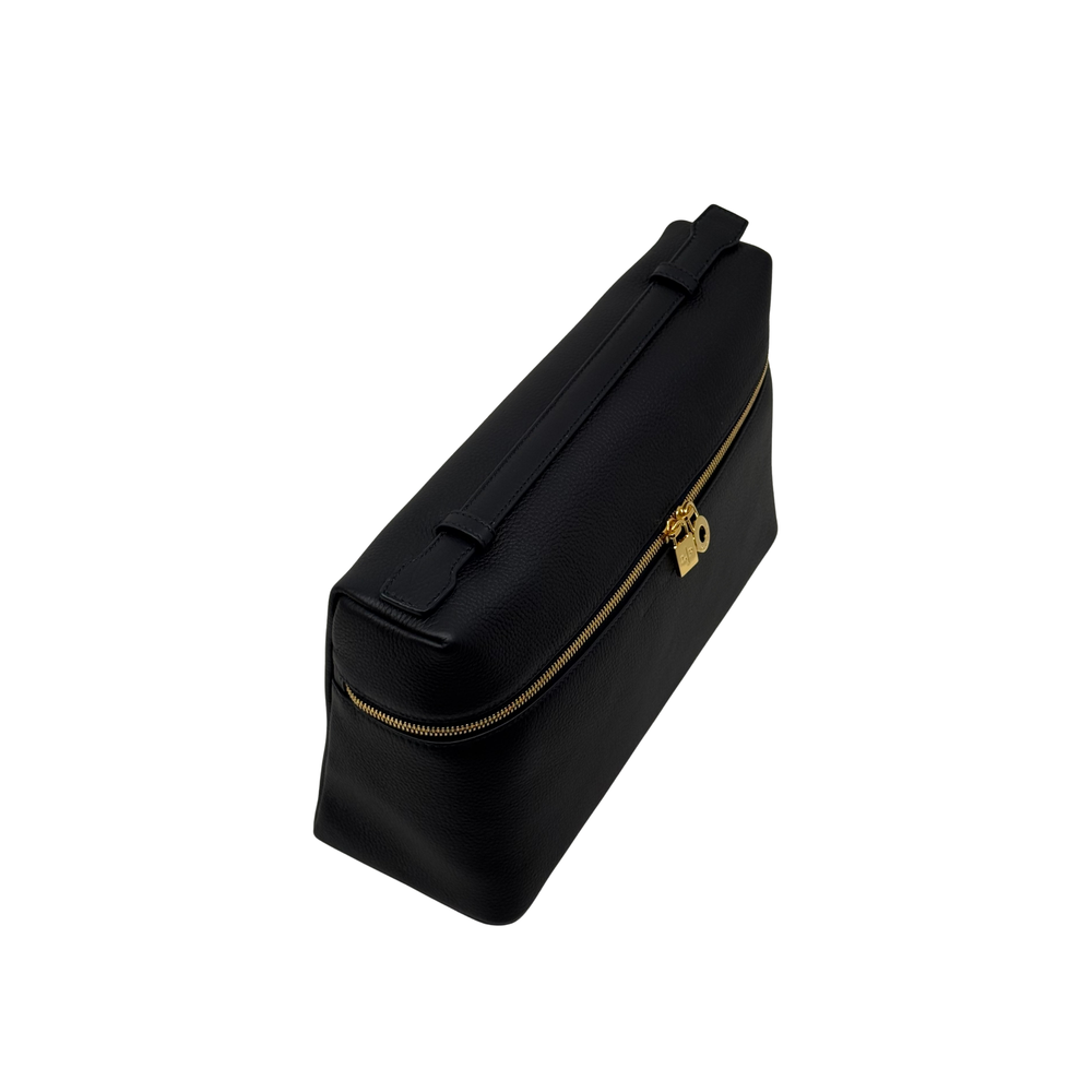 Black leather crossbody zip pouch with gold zipper and shoulder strap
