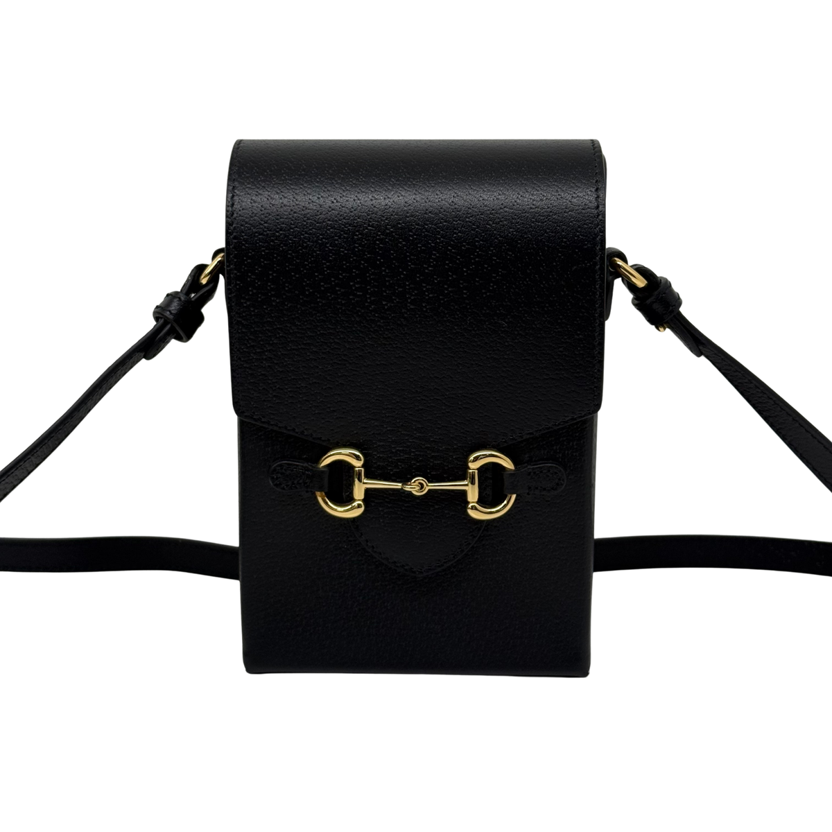 Black leather crossbody bag front flap and shoulder strap