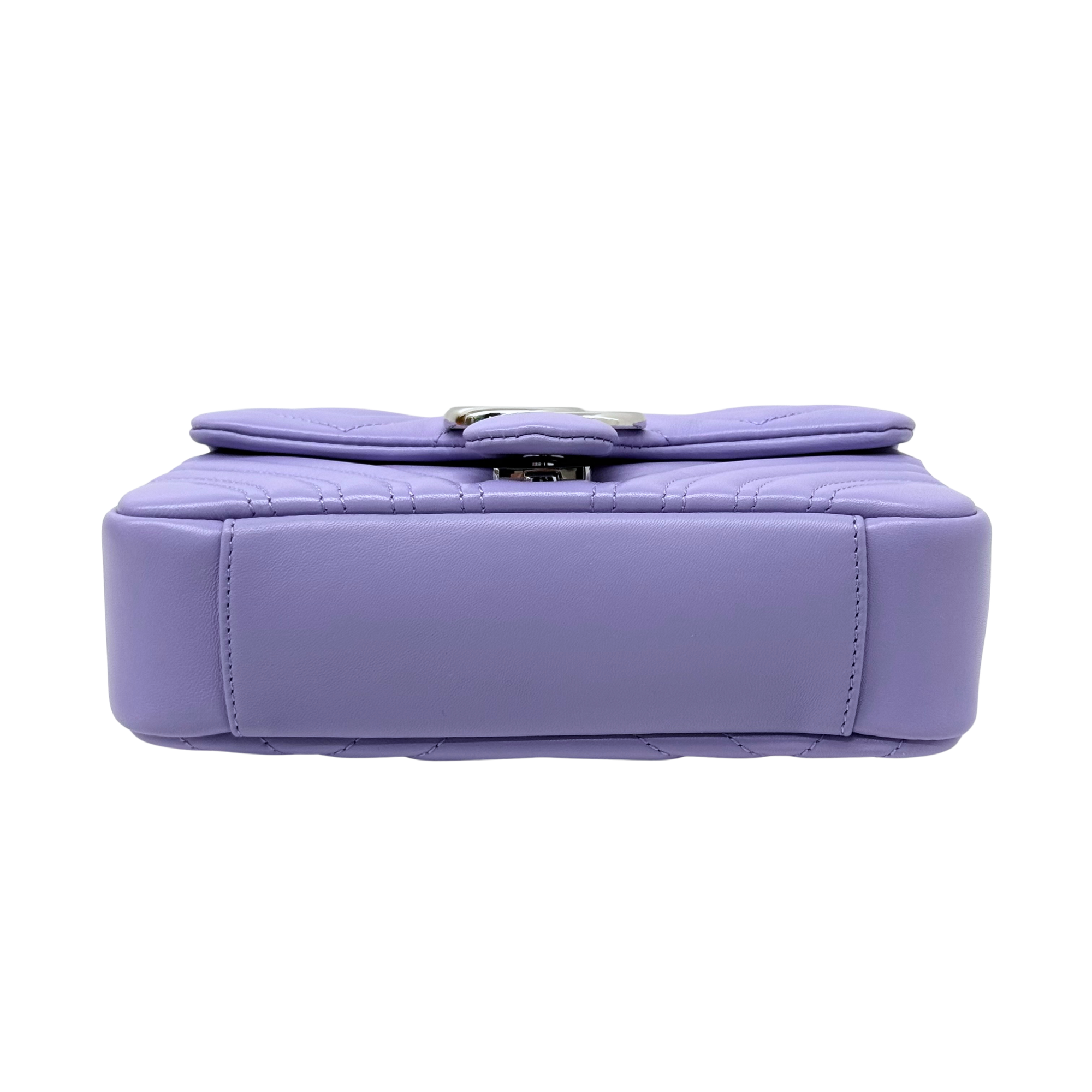 Lavender mini bag back view with top flap and stitched rectangular base