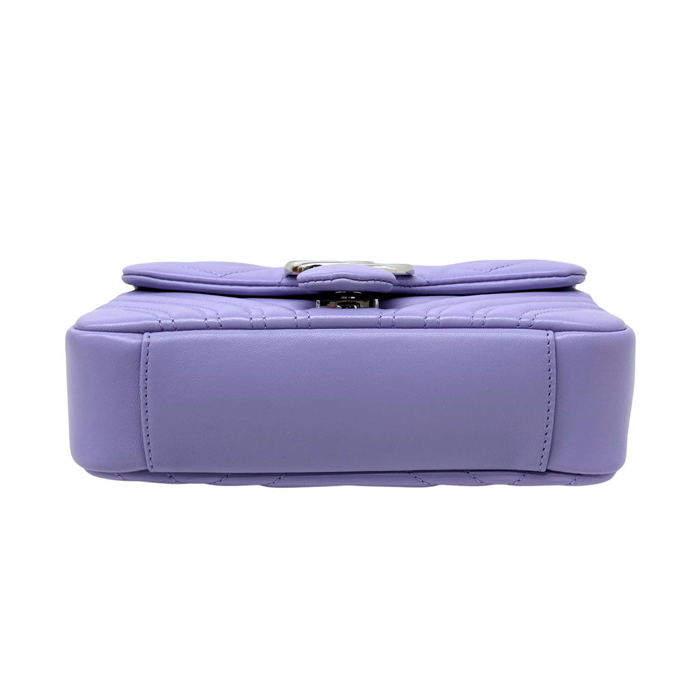 Lavender mini bag back view with top flap and stitched rectangular base