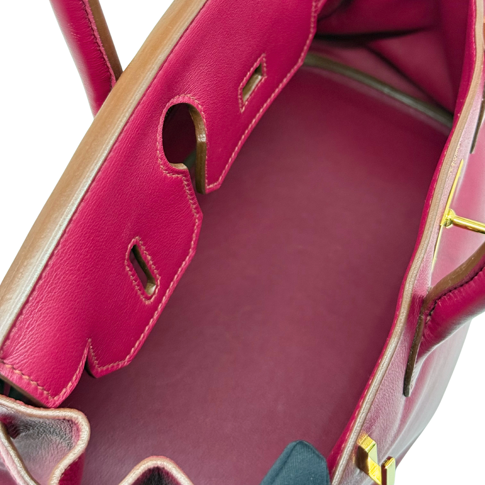 Magenta leather Birkin bag interior pocket with stitched trim and cutout