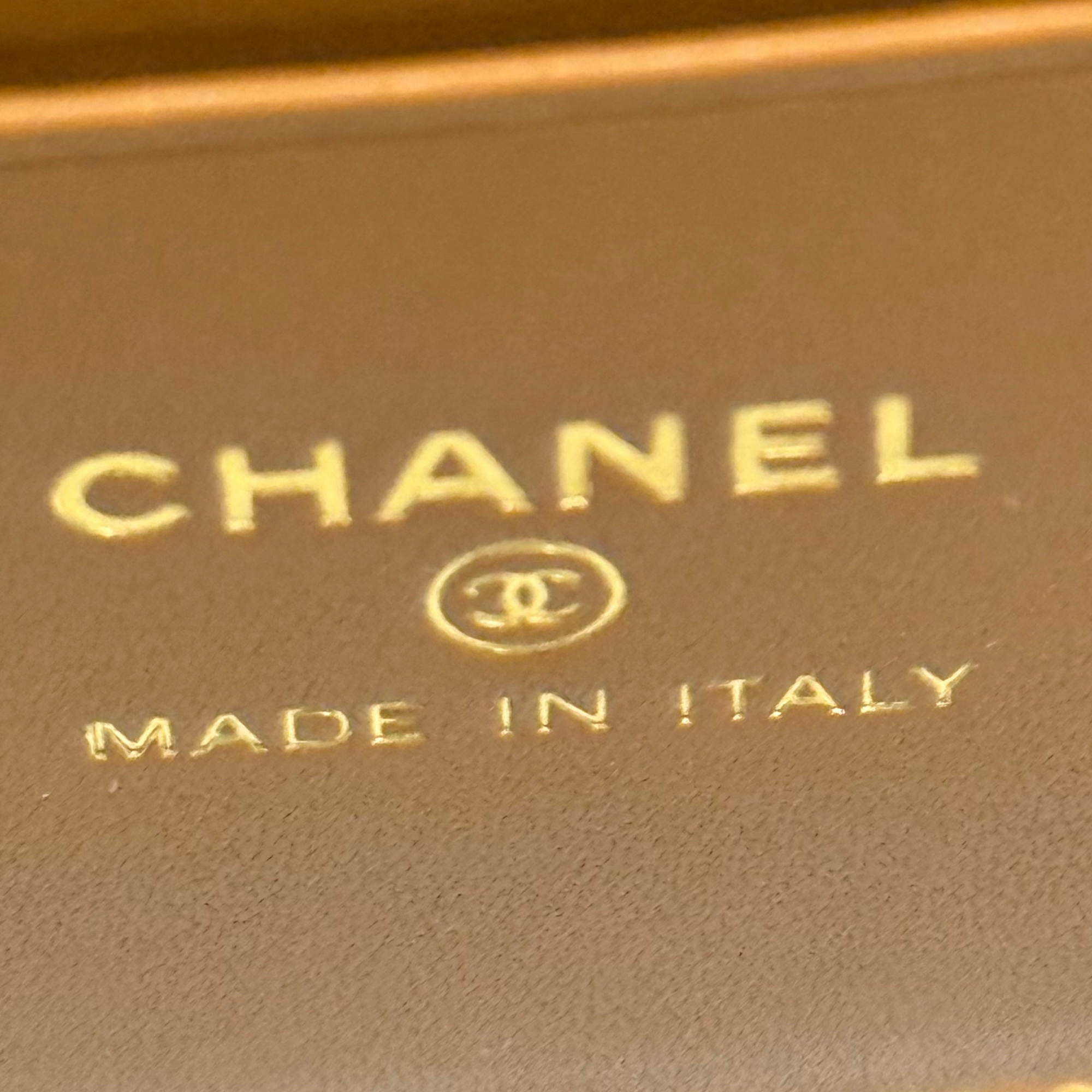 Chanel logo on brown leather patch, with “Made in Italy” stamp