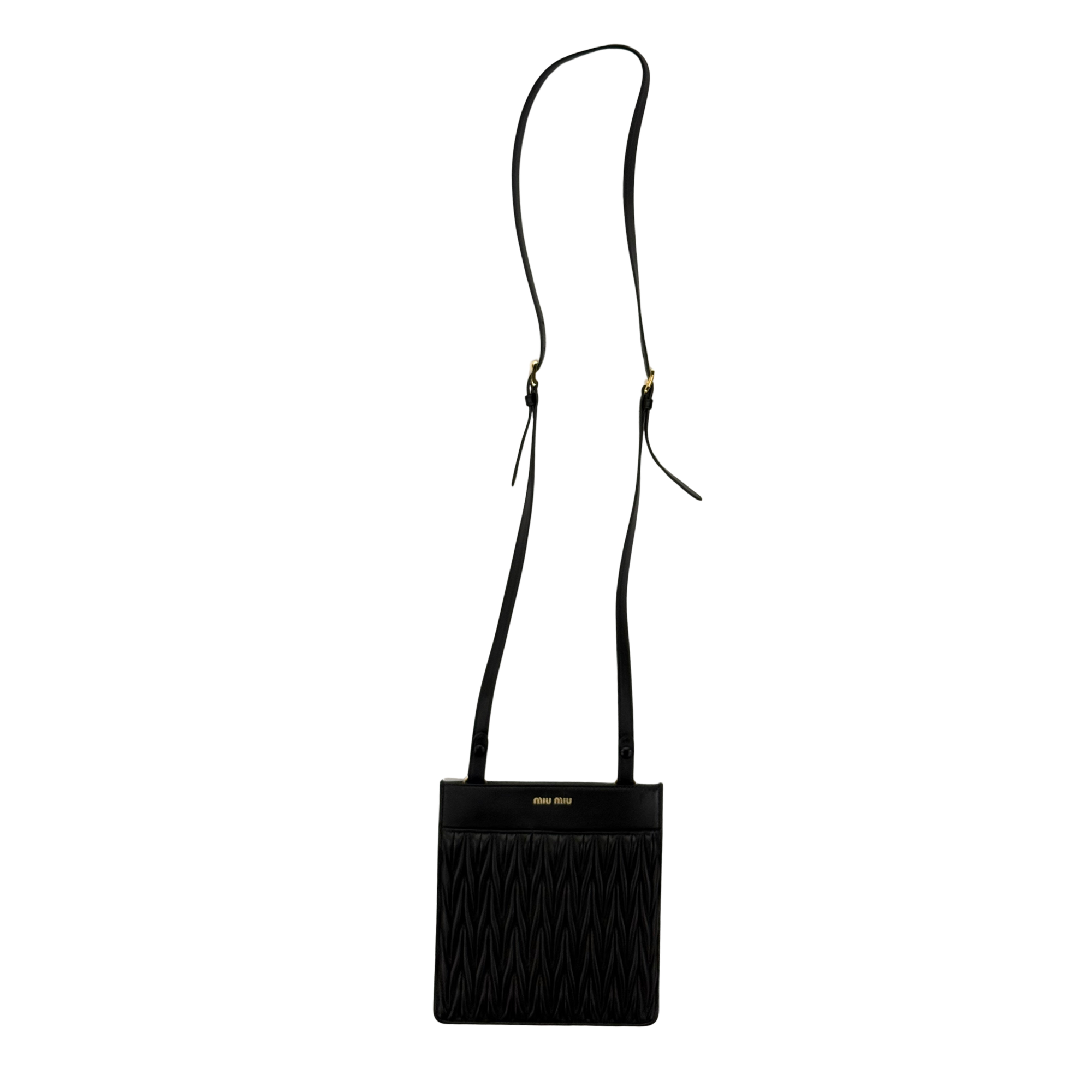Black mini crossbody bag with quilted ridges and long adjustable shoulder strap