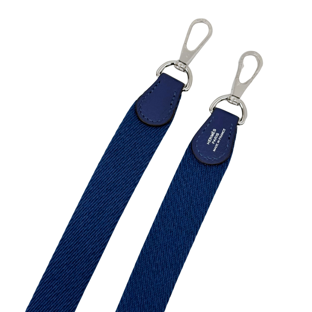 Navy blue crossbody strap with silver-tone clips and attachment loops
