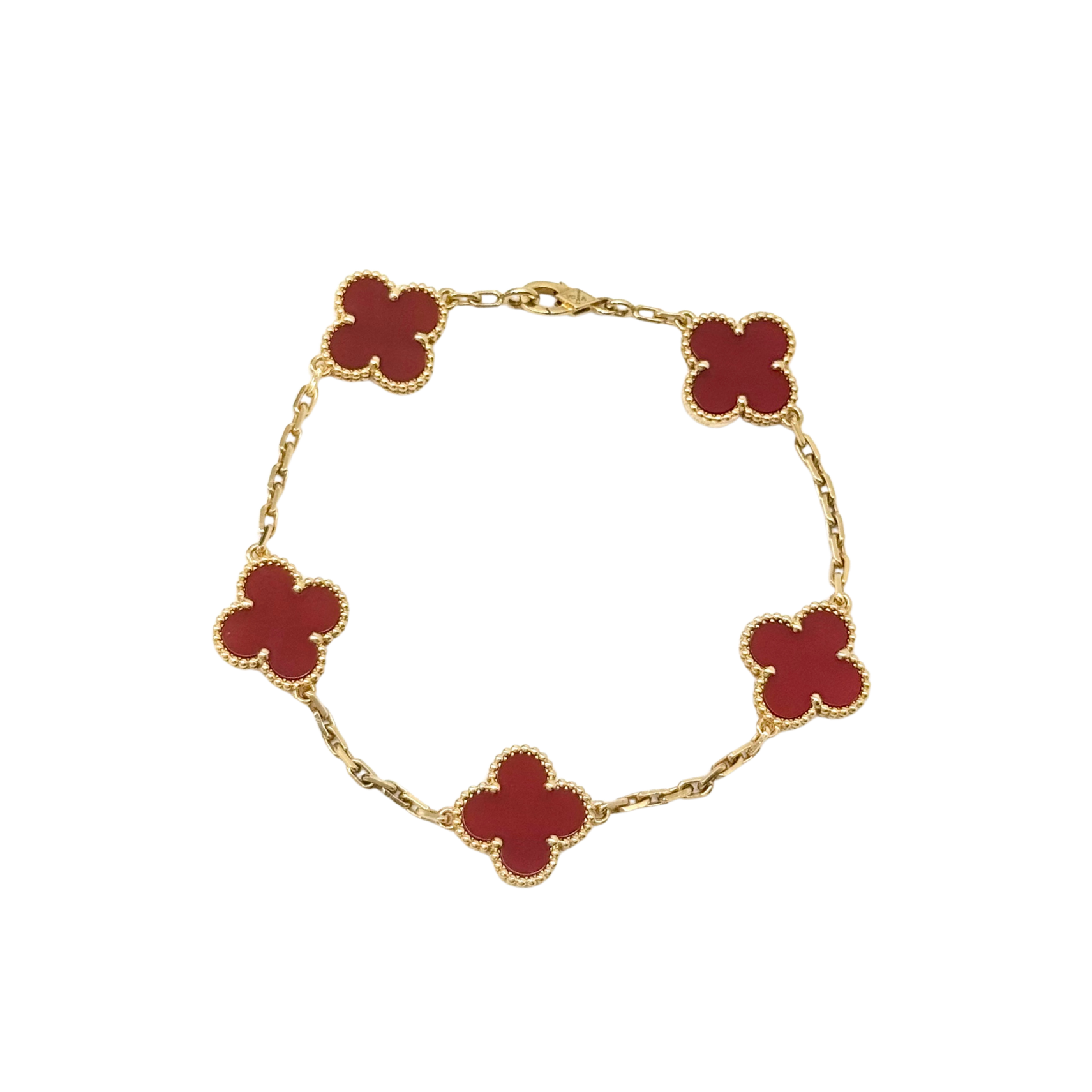 Goldtone bracelet with five red clover motifs on linked chain, full view