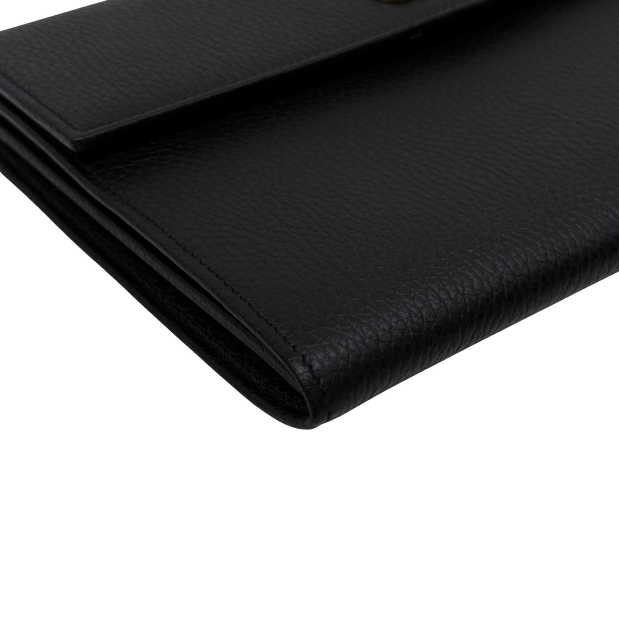 Black leather wallet corner with visible stitching and textured grain