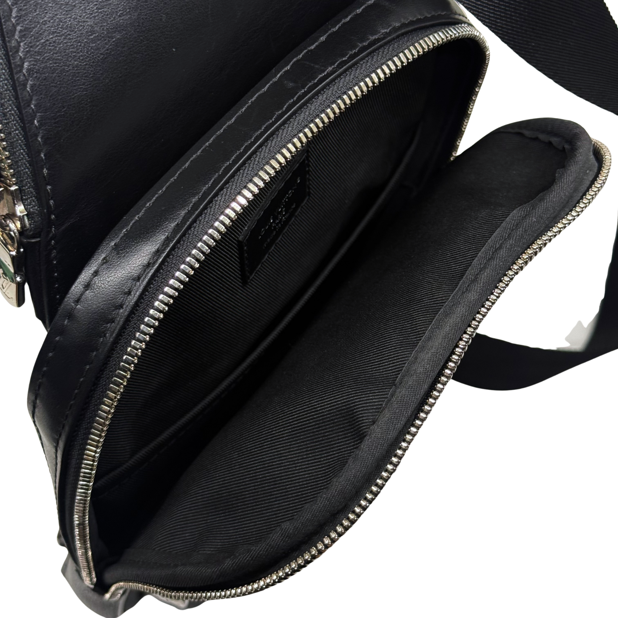 Damier check crossbody bag with zippered opening and black fabric interior