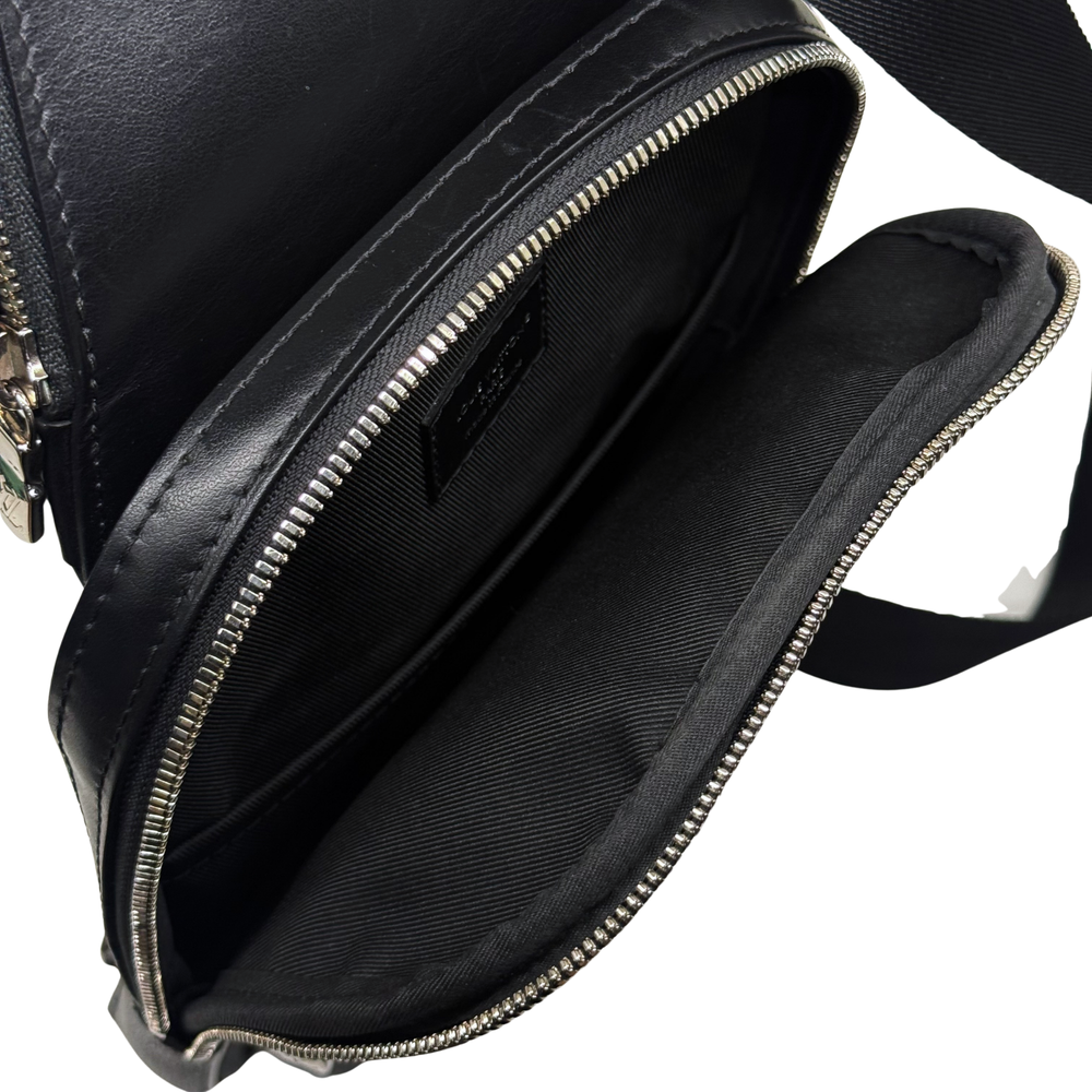 Damier check crossbody bag with zippered opening and black fabric interior