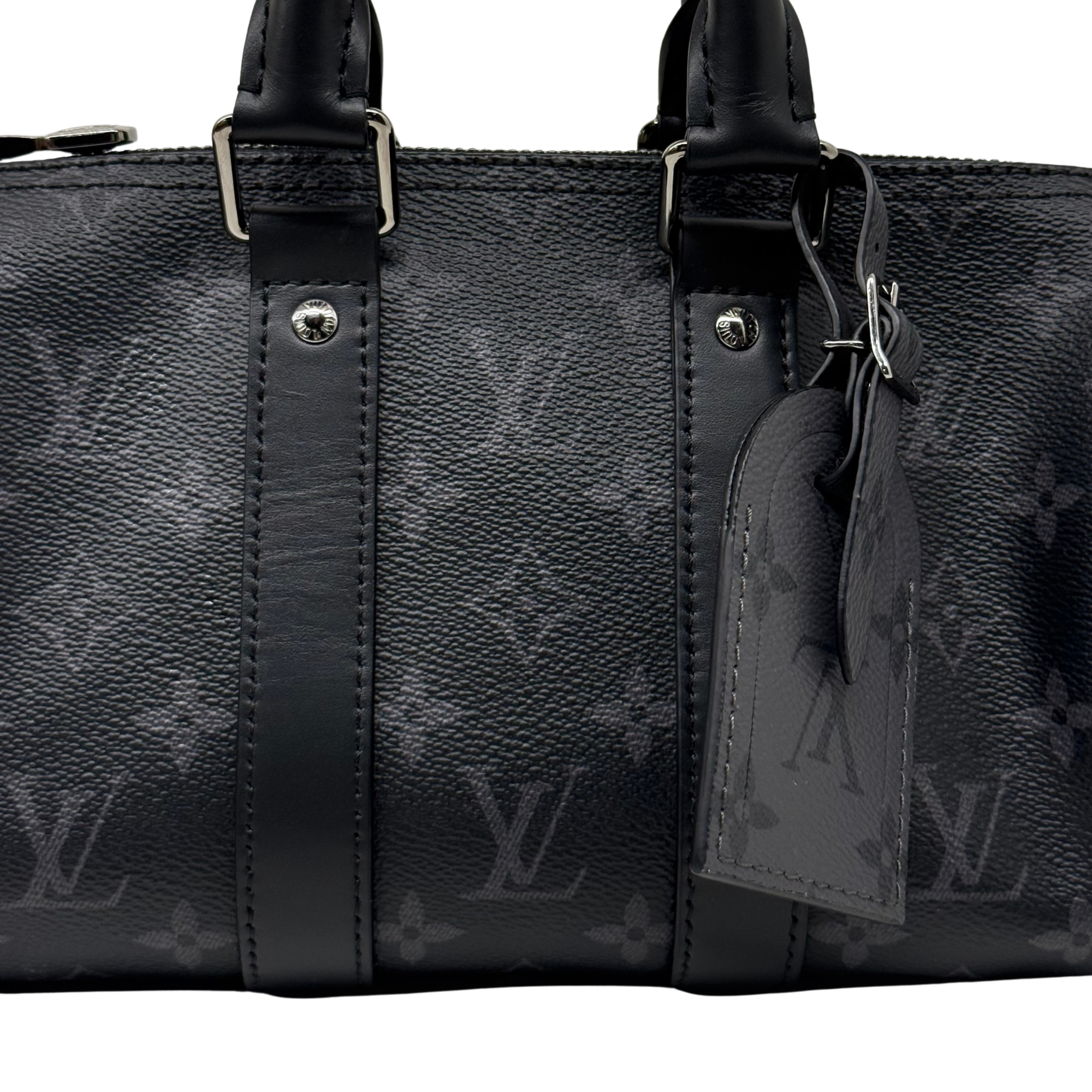 Pre-owned Louis Vuitton black monogram handbag close-up of leather straps and hanging tag