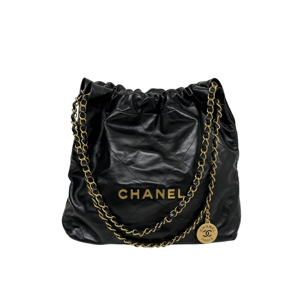 Black drawstring top shoulder bag with gold chain straps and gold logo charm