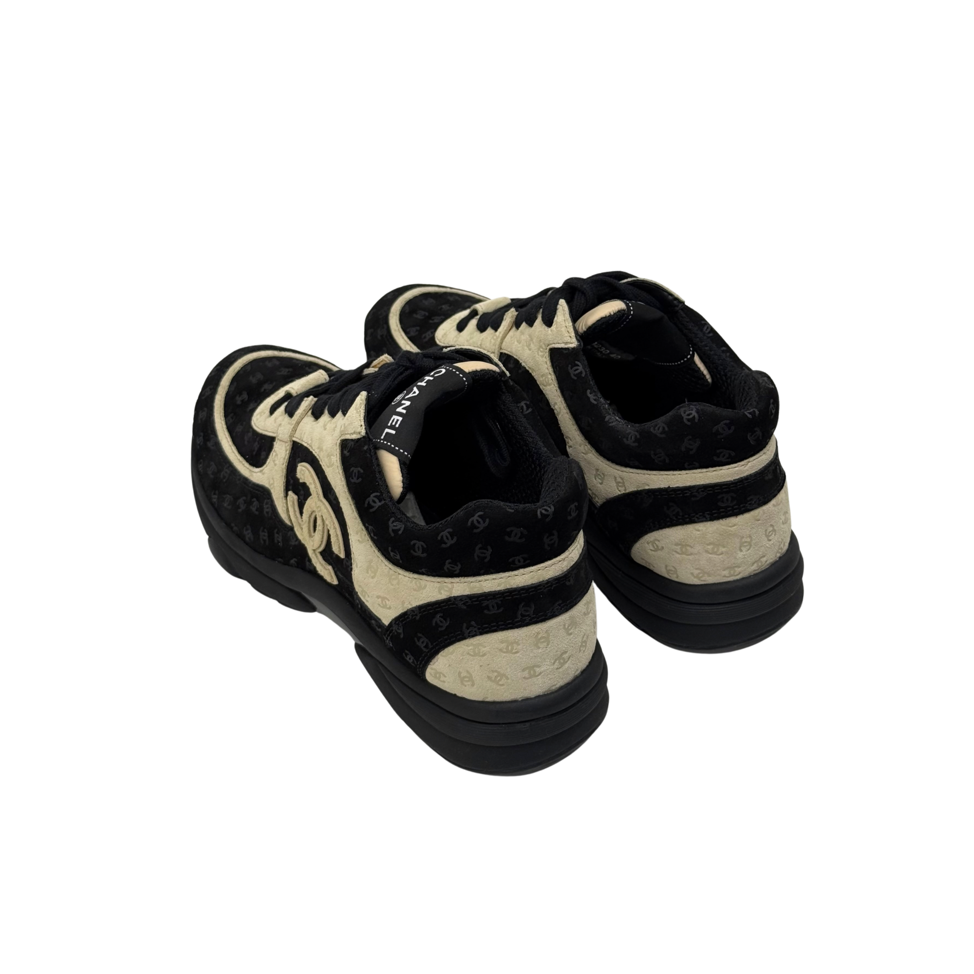Black and beige Chanel sneakers, rear view with lace-up and thick cushioned sole