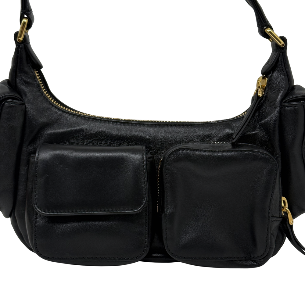 Black leather shoulder bag front with two stitched patch pockets and gold zipper trim