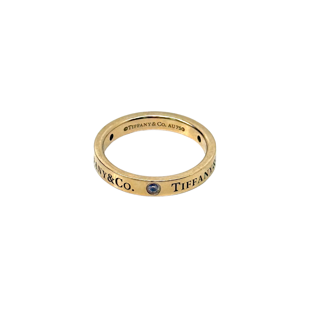 Pre-owned Tiffany & Co. yellow gold band ring with blue gemstone and AU750 marks