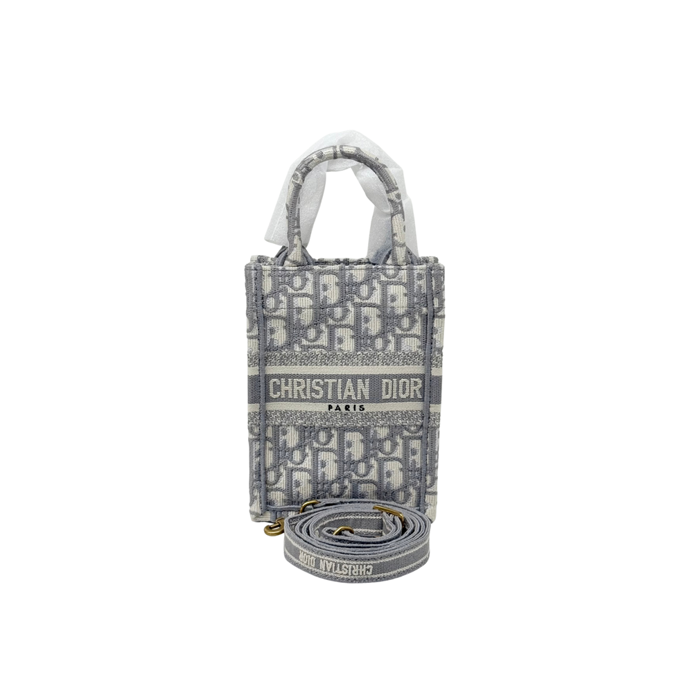 Dior mini tote with top handles, monogram print and "CHRISTIAN DIOR PARIS" with strap
