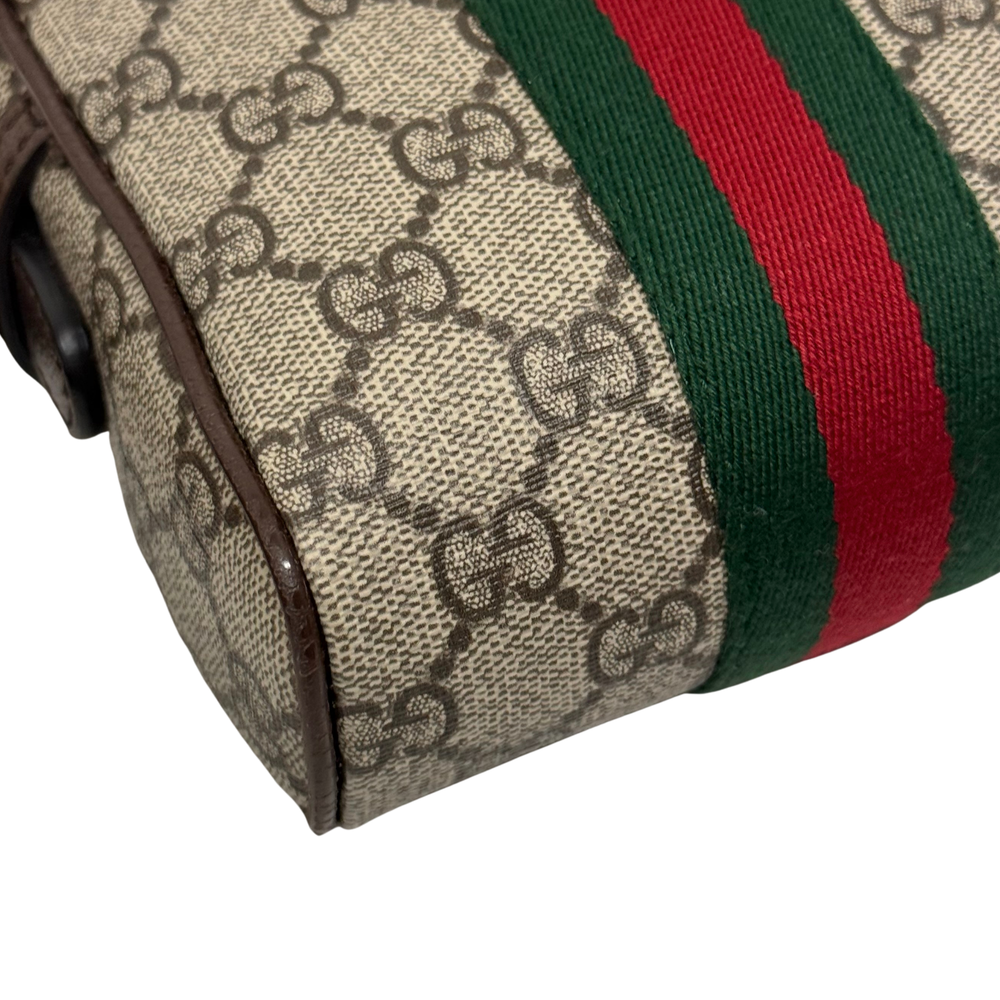 Gucci GG canvas bag end panel with vertical green and red web stripe and dark brown edging