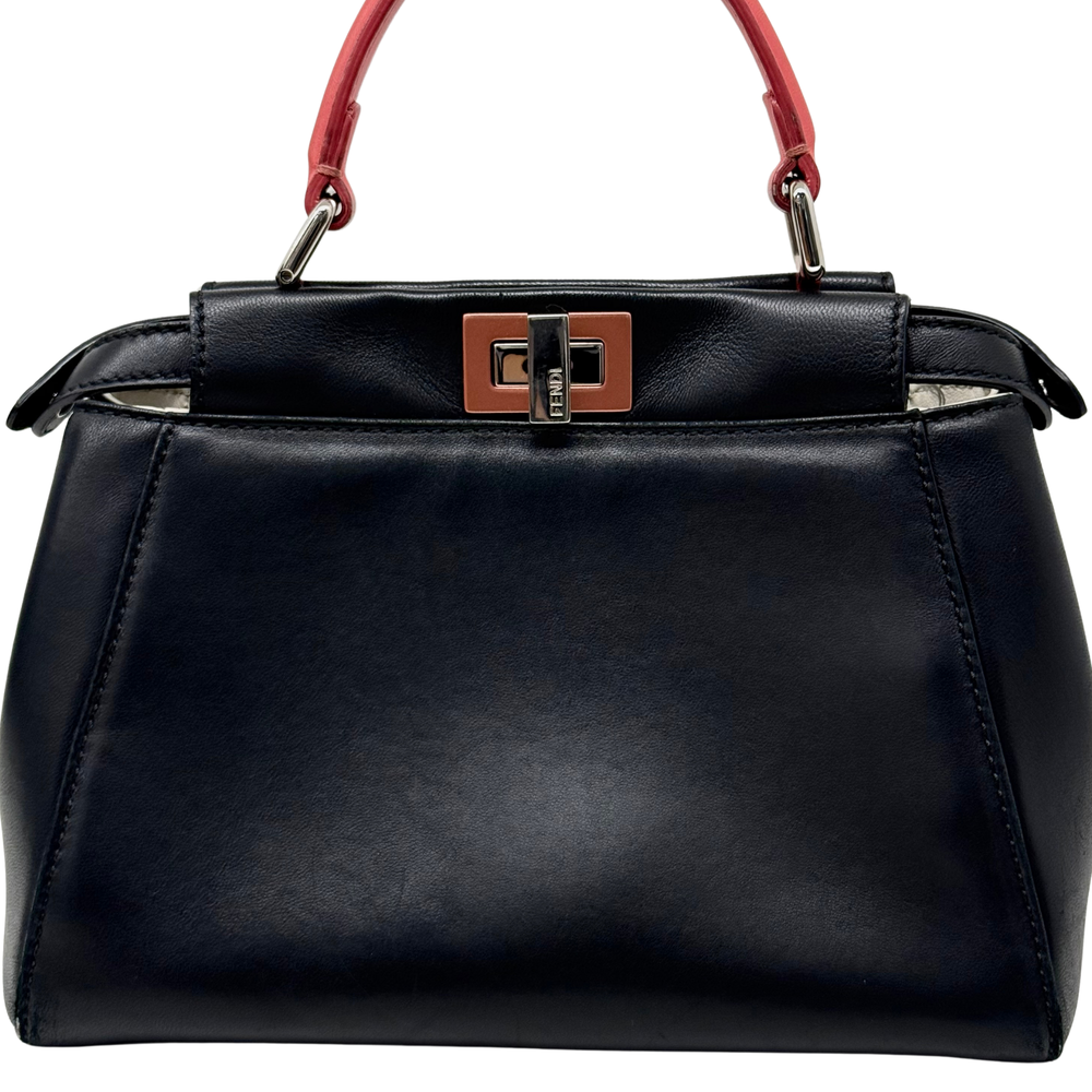 Pre-owned Fendi black leather handbag front view, coral-pink handles and metal lock hardware