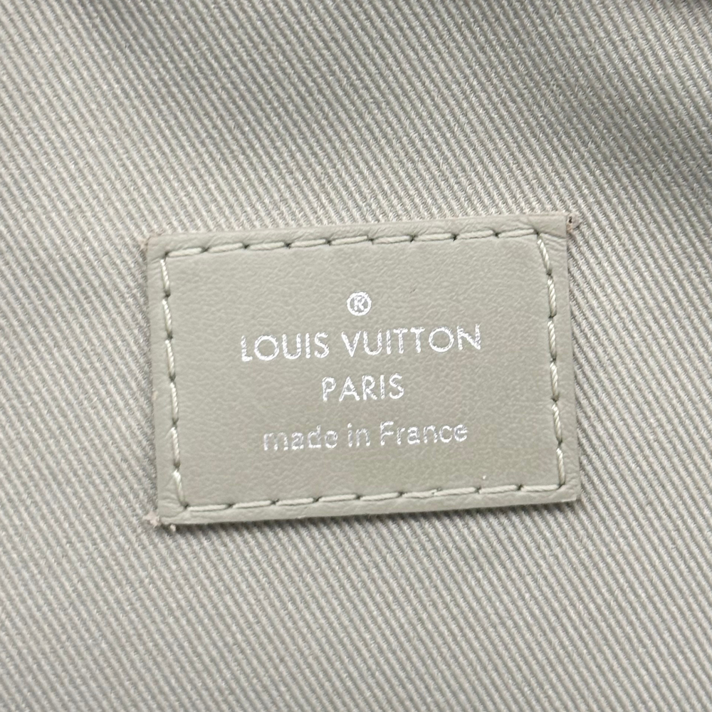 Pre-owned crossbody bag interior label with Louis Vuitton Paris branding and stitching