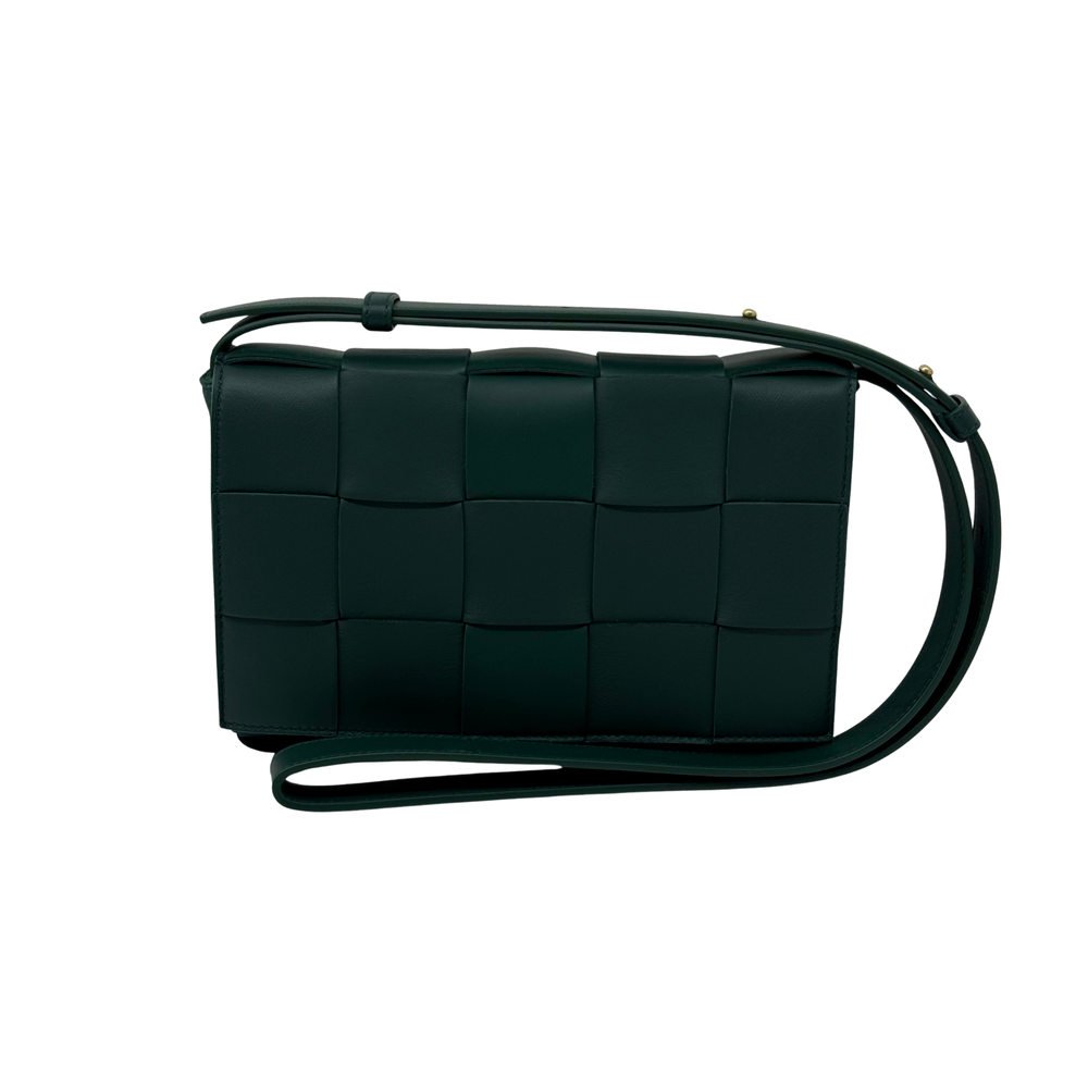 Dark green woven leather crossbody bag with adjustable strap and square quilted panels