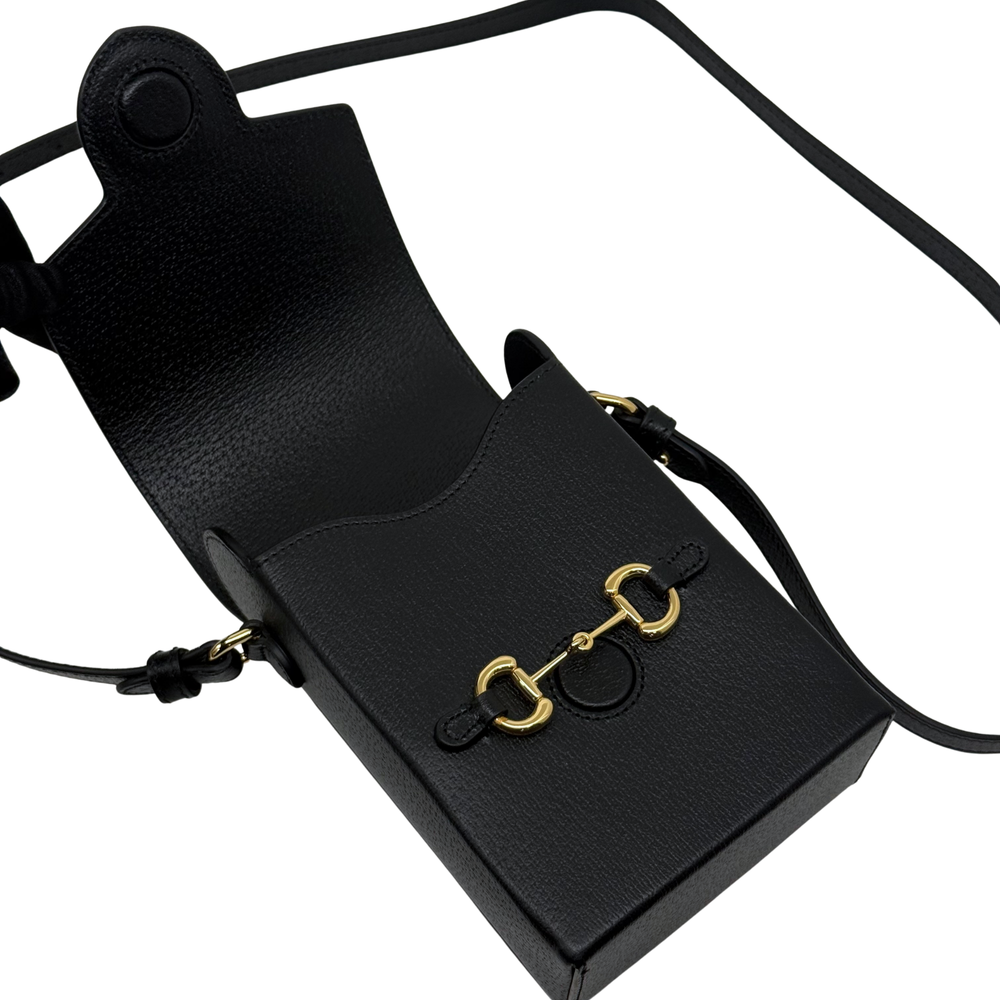 Gucci black leather mini crossbody bag front with strap and gold clasp