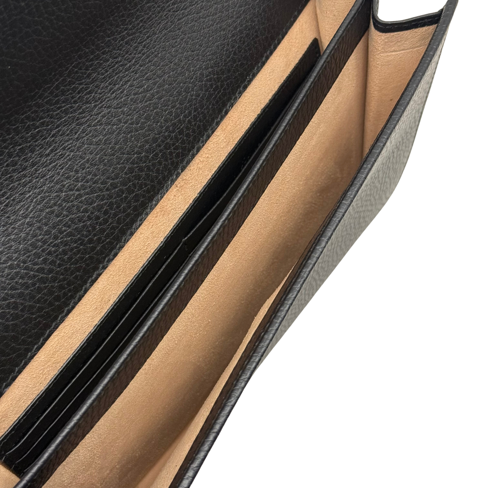Black leather wallet interior with slim card slots and edge stitching