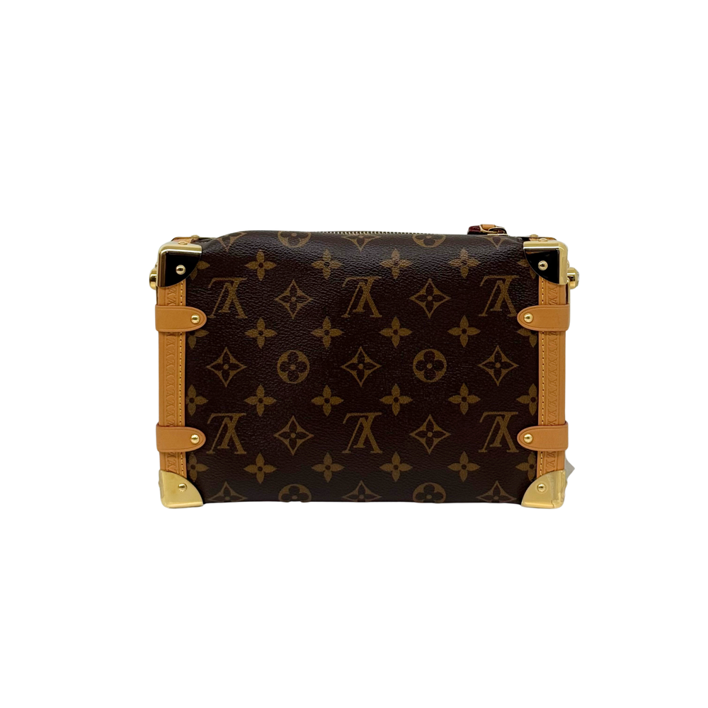 Monogram crossbody bag back view with tan leather strap and gold-tone corner hardware