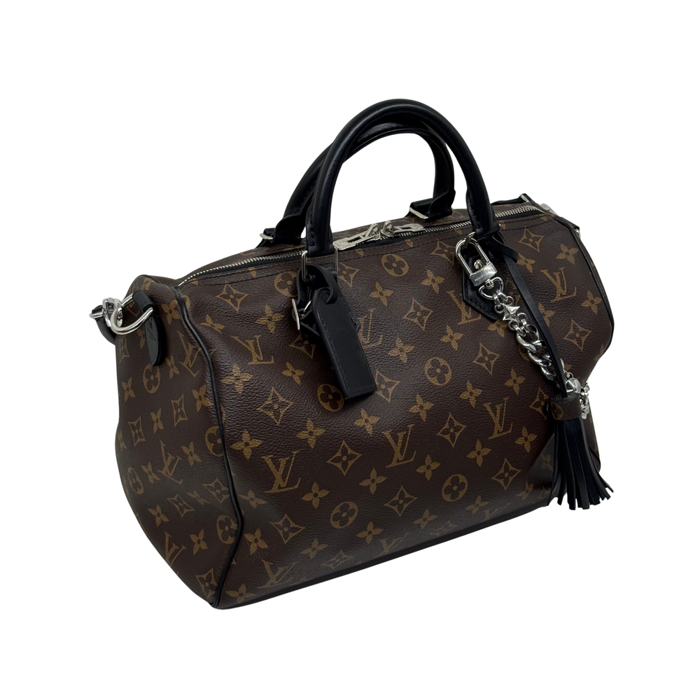 Louis Vuitton pre-owned monogram duffel bag with black shoulder strap and tassel charm