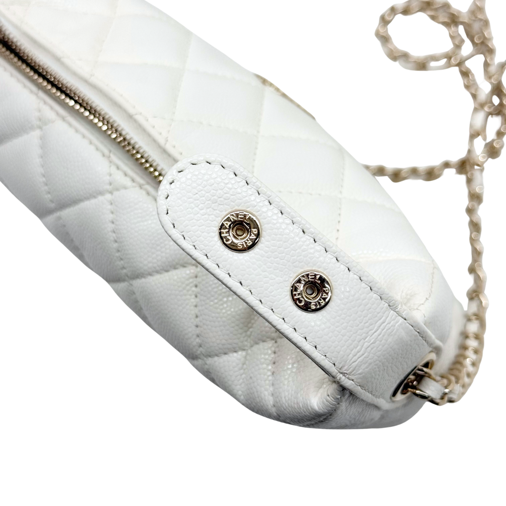 Chanel quilted white bag with chain strap connector and gold-tone snap details