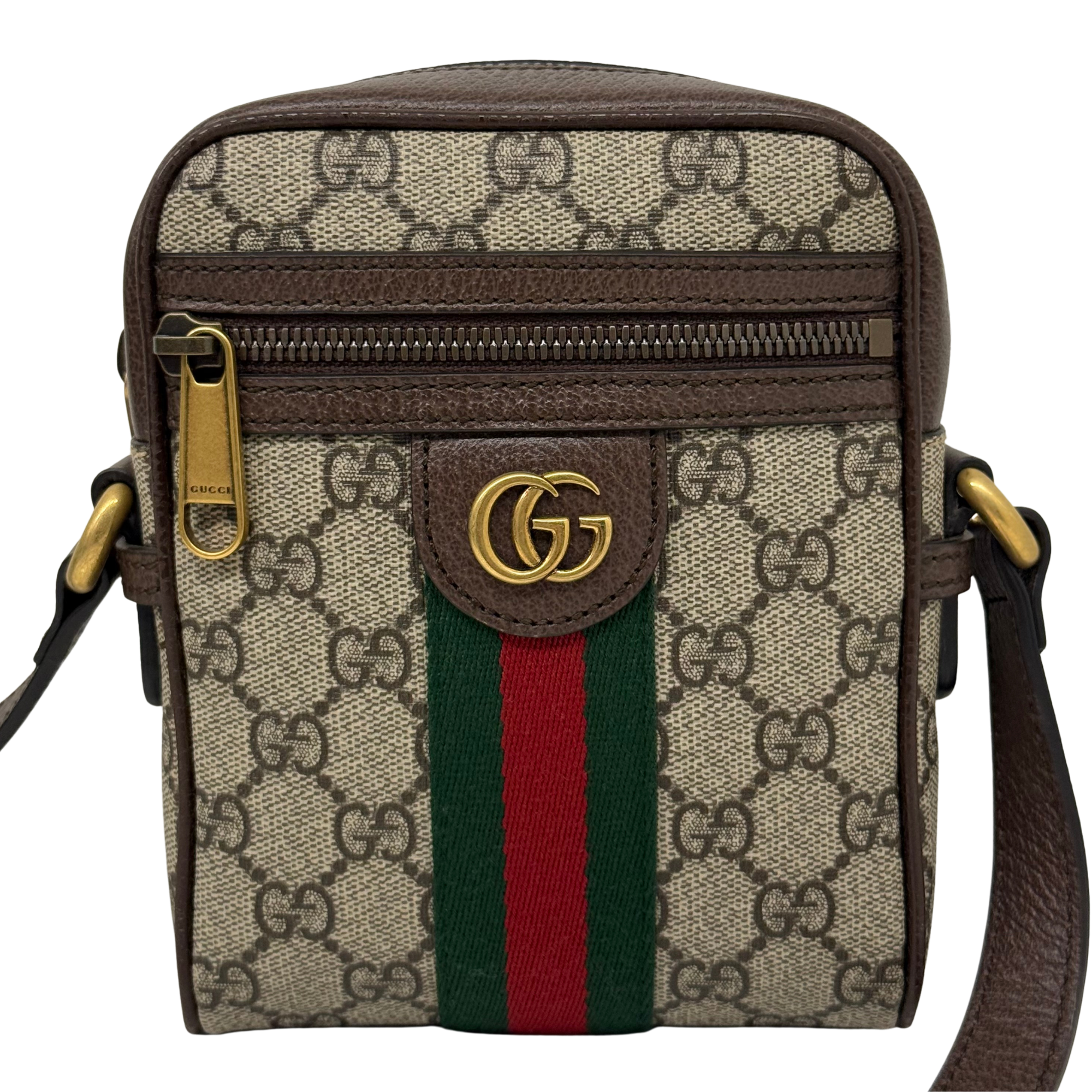 Gucci GG canvas crossbody bag front with flap, green and red web stripe, and gold-tone clasp