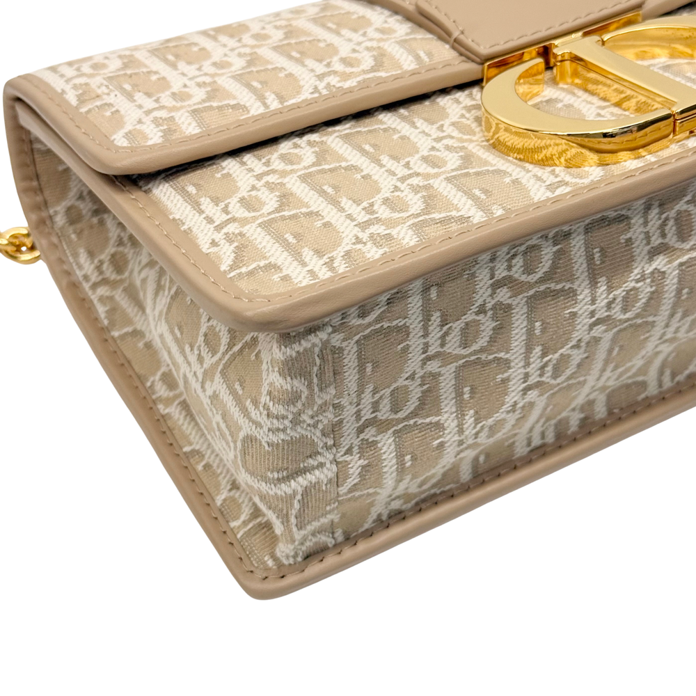 Pre-owned Dior mini bag, beige canvas flap with gold clasp and detailed stitching