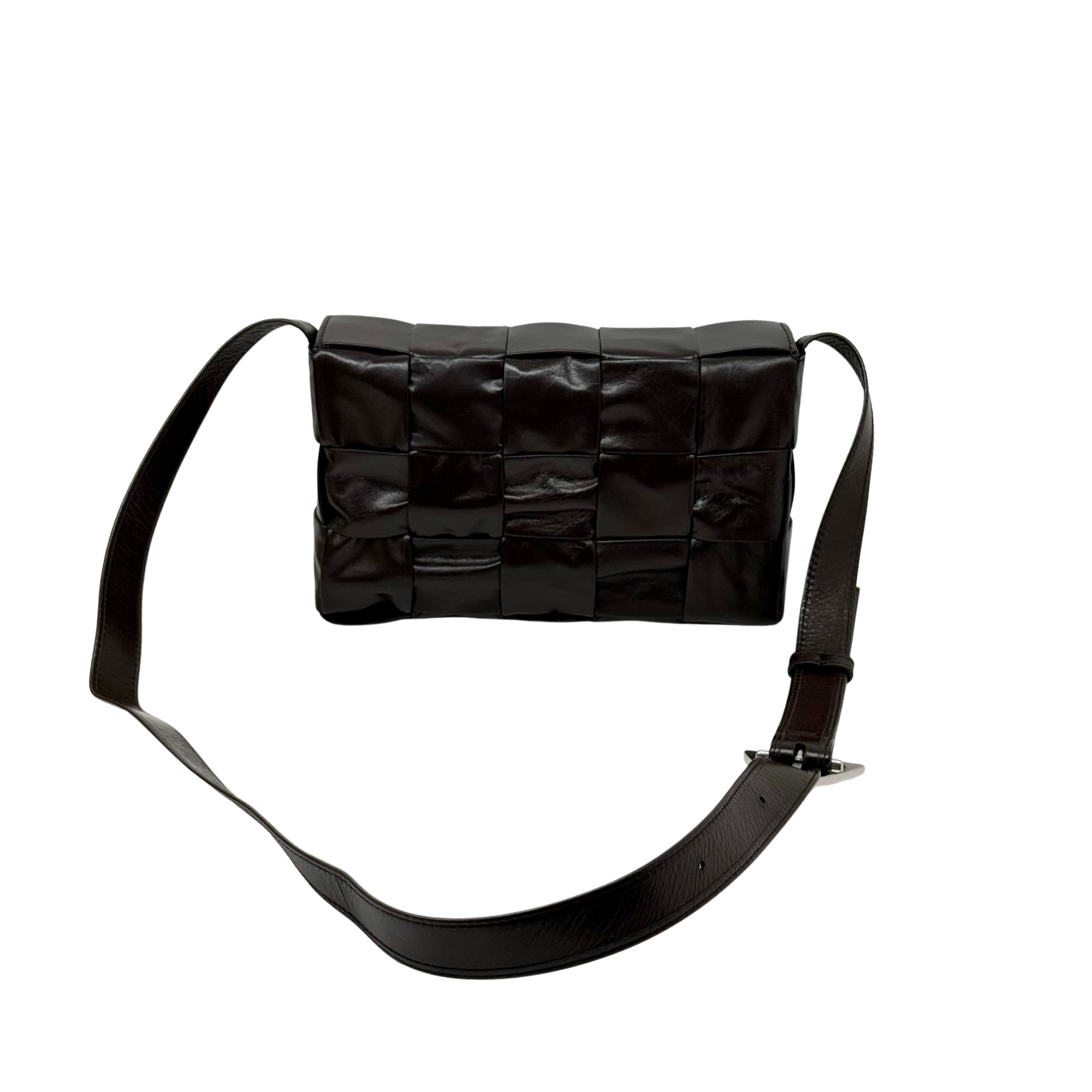 Quilted dark crossbody bag with top flap and wide adjustable shoulder strap